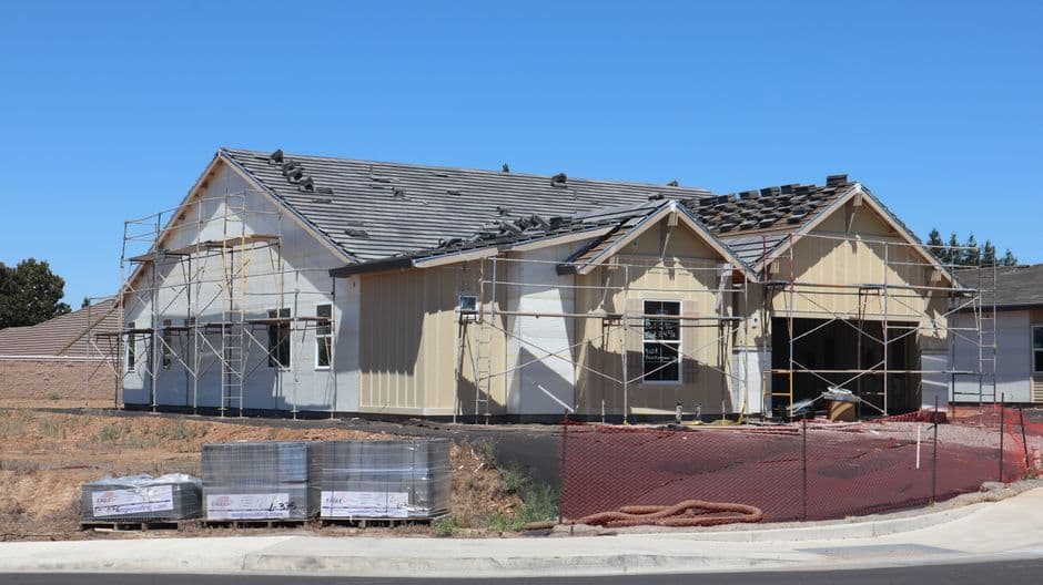 A new home being built in a residential area in Elk Grove, California, showcasing construction progress.